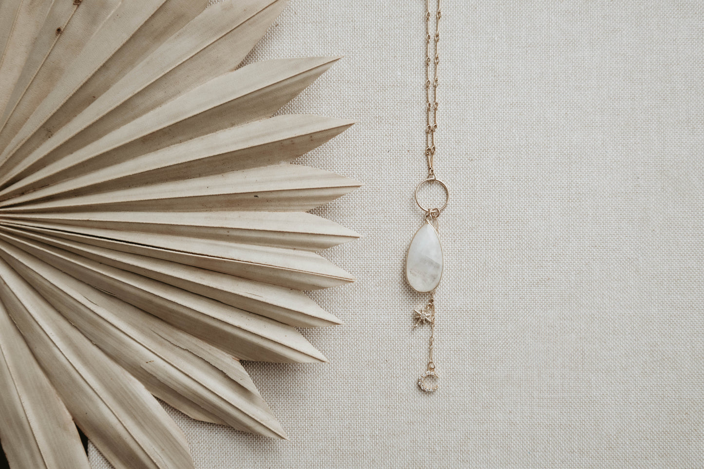 Moonstone pendant necklace with charms